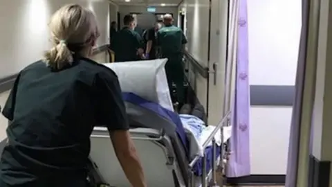 BBC Patient on trolley in A&E