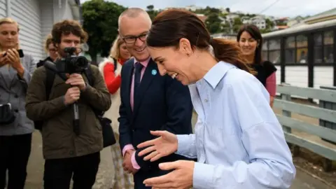 Getty Images Mr Clark and Ms Ardern on 12 March, before the lockdown