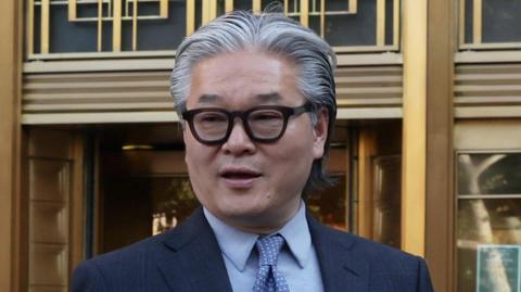  Bill Hwang walks out of federal court after being found guilty of fraud.