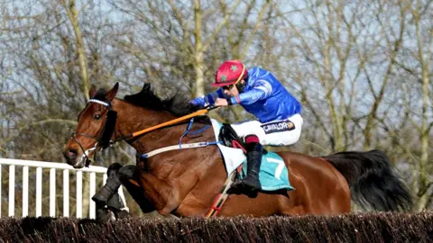 PA Media Screaming Colours ridden by jockey Conor Orr on their way to winning the Boulton Group Midlands Grand National at Uttoxeter Racecourse,