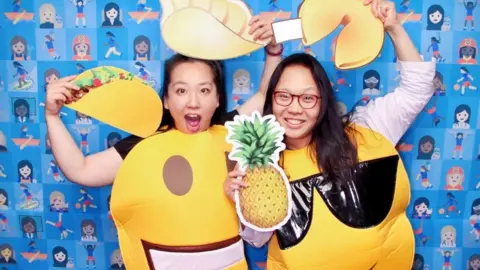 Yiying Lu Yiying and Irene dressed as emoji