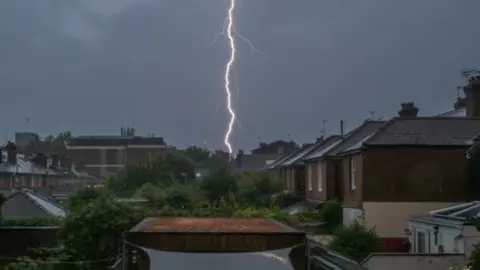 Mike Hall Lightning over Winchester rooftops