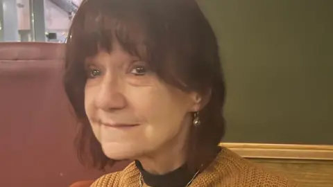 Jane Ibbunson Jane Ibbunson has short brown hair and is sitting down