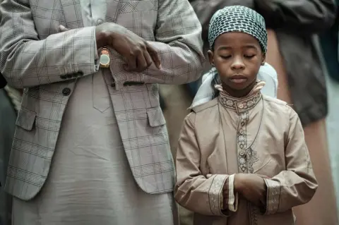 AFP Kenyan Muslim worshippers attend Eid al-Fitr prayers to mark the end of the Muslim holy month of Ramadan on 4 June at the Jamia Mosque in Nairobi, Kenya.