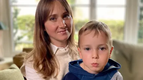 Martin Giles/BBC Viktoriia and her son Dmytro, aged three