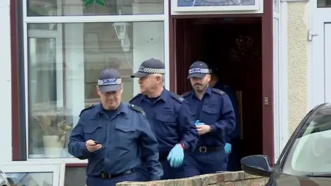 Police outside a house