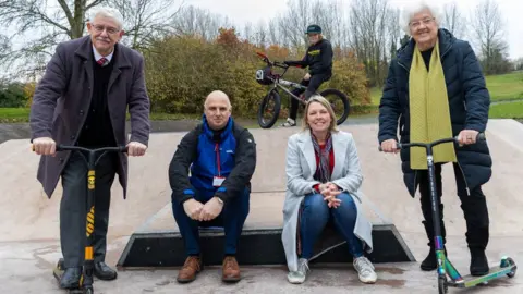 Telford and Wrekin Council BMX freestyle rider Chester Turner at Wombridge skate park with left to right, ward member councillor Stephen Reynolds, play officer Richard Foden, cabinet member for climate change, green spaces, natural and historic environment and cultural services, Carolyn Healy and ward member councillor Hilda Rhodes.