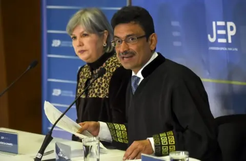 AFP Colombian magistrate of the Peace Court Jesus Bobadilla (R) speaks next to Colombian President of the Special Jurisdiction for Peace Patricia Linares (JEP)