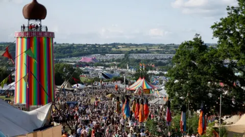 REUTERS/Jason Cairnduff Crowds in front of the Ribbon Tower at Glastonbury Festival
