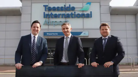 Teesside Airport Tees Valley mayor Ben Houchen, Phil Clements from SSE Energy Solutions and airport managing director Phil Forster