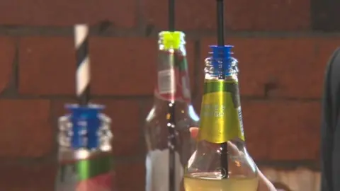 BBC Anti-spiking devices in glass bottle