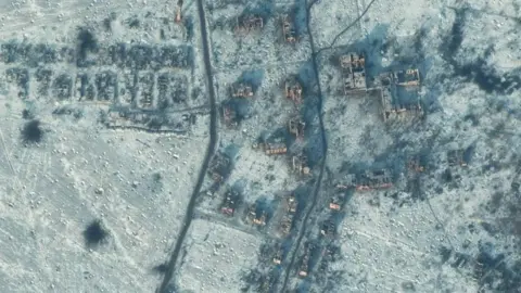 Maxar Technologies A satellite view shows a destroyed school and buildings in south Soledar, Ukraine, January 10, 2023