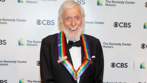 Getty Images Dick Van Dyke smiles for cameras on the red carpet.