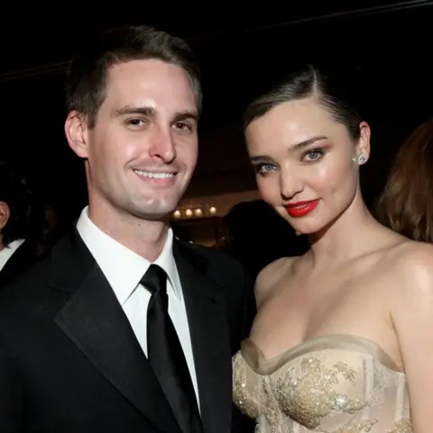 Getty Images Snapchat founder Evan Spiegel (L) and his wife, model Miranda Kerr