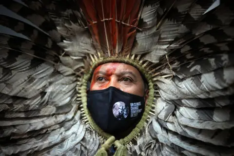 Christopher Furlong / Getty Images A member of the Minga Indigena indigenous delegation