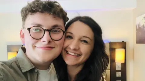 Georgia Lee Georgia posing with her boyfriend Laurence