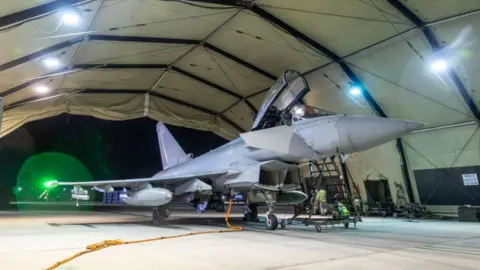 MOD An RAF Typhoon pictured back at its base in Cyprus after launching strikes on Yemen's Houthi rebels