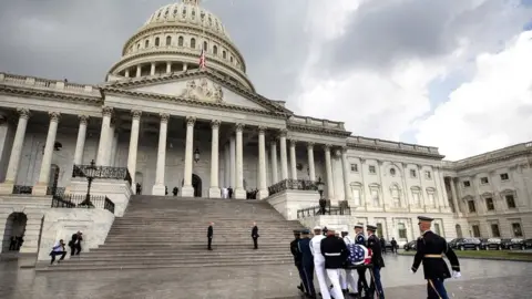 Reuters Joint service members of a military casket team prepare carry the casket of US Senator John McCain into the US Capitol, where he will lie in state for the rest of the day in Washington on 31 August 2018