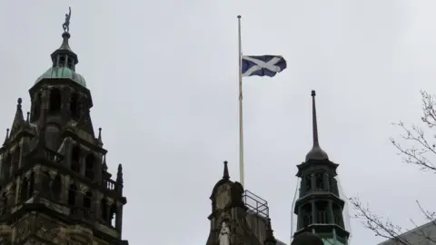 The Steel City Snapper St Andrew's Cross being flown over Sheffield Town Hall