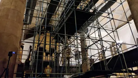 Father Oliver Coss Scaffolding inside All Saints' Church