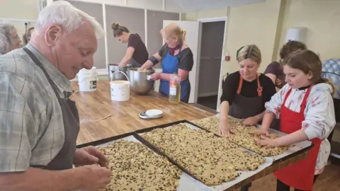 Brickyard Bakery and Academy Volunteers preparing food