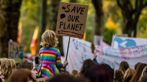 Bloomberg/Getty Images COP26 march