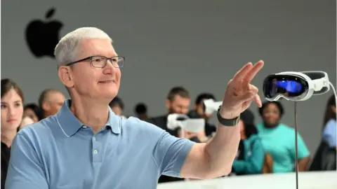 Getty Images Apple boss Tim Cook beside the Vision Pro