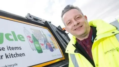 Newcastle City Council Nick Kemp next to a bin lorry