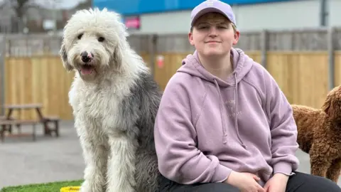 Bridgend Doggy Day Care Kate Thomas with a dog