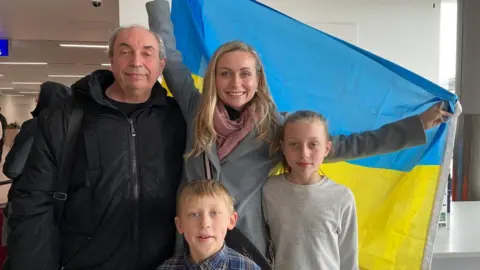 BBC Mykola Katrechko reunited with his daughter Olena Shackell and her children at Bristol Airport