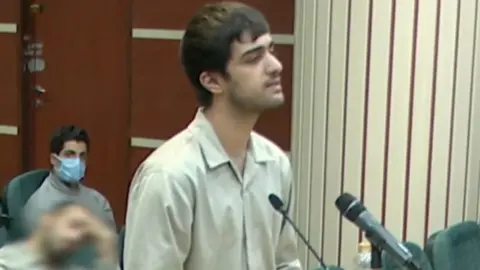 Iranian State TV Mohammad Mahdi Karami attending a court hearing in Karaj, Iran, a month before he was executed