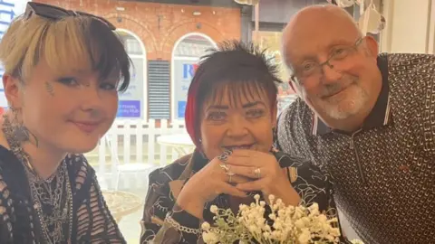 Family handout Sandie Griffin with her husband Mike, 67, and 21-year-old granddaughter River