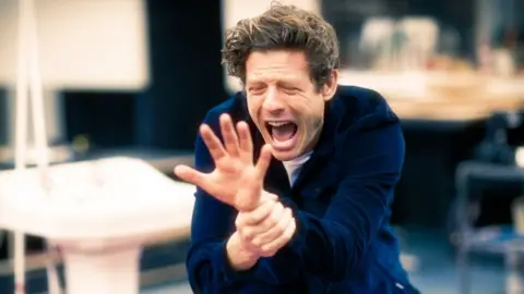 Jan Versweyveld James Norton holding his wrist in pain in A Little Life