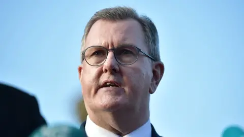 Getty/Charles McQuillan Democratic Unionist party leader Sir Jeffrey Donaldson is pictured during a press conference following discussions at Hillsborough Castle on December 19, 2023 in Belfast