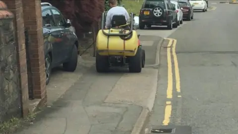 Torfaen Residents Take Action Group Man spraying weeds