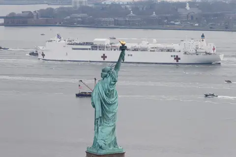 Mike Segar / Reuters USNS Comfort passes the Statue of Liberty