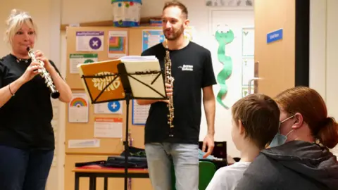 Britten Sinfonia/Shoel Stadlen Britten Sinfonia oboists playing on the paediatric oncology ward at Addenbrooke's Hospital,Cambridge