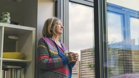 Getty Images A woman self-isolating