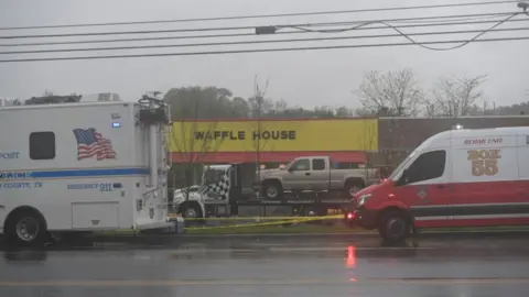 Reuters The pickup truck owned by Mr Reinking is towed to an evidence storage agrea