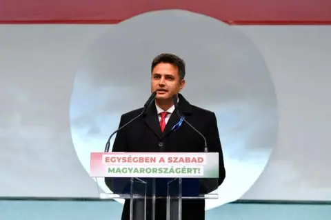 Reuters Opposition candidate for Prime Minister Peter Marki-Zay speaks during a joint demonstration organised by opposition parties during the celebrations of the 65th anniversary of the Hungarian Uprising of 1956, in Budapest, Hungary, in October 2021