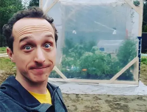 Instagram/kbaute An instagram picture from Kurtis Baute shows him posing nervously in front of the plastic biodome