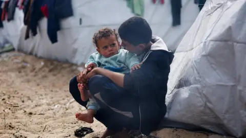 Reuters Two children in Gaza