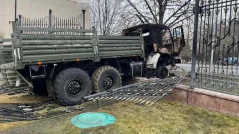 BBC A truck driven into a gate in Almaty