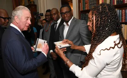 Getty Images Prince Charles, Prince of Wales is presented with a CD from Composer Shirley Thompson as he hosts a reception for supporters of The Powerlist at Clarence House on March 01, 2022