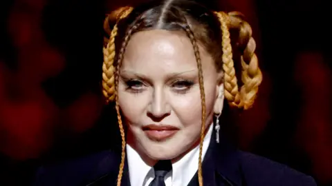 Frazer Harrison Madonna speaks onstage during the 65th GRAMMY Awards at Crypto.com Arena on February 05, 2023 in Los Angeles, California