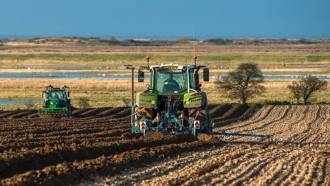 Getty Images Tractors in a field