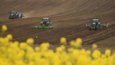 Getty Images Tractors on a field