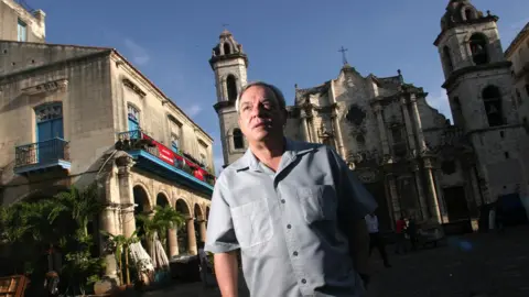 Getty Images Eusebio Leal walks at the Cathedral square, May 5, 2004, in Havana, Cuba