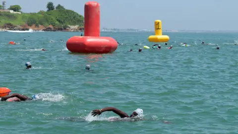 Seyllou/AFP Swimmers in a race between Dakar and the former slave island of Gorée in Senegal - Sunday 24 September 2023