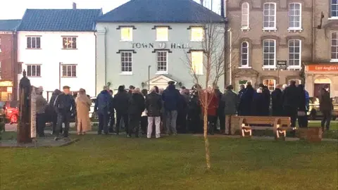 Taila Taylor Crowd gathered in a town centre